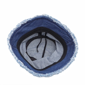 Blue denim bucket hat with frayed edges and adjustable inner drawstring for women