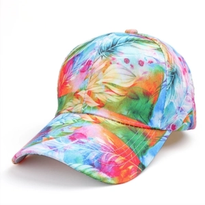 Baseball cap featuring vibrant rainbow feather leaf prints and curved brim on white background