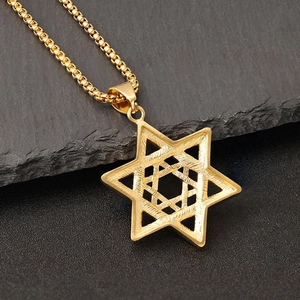 Iced out gold Hexagram Star of David pendant necklace with box chain on slate