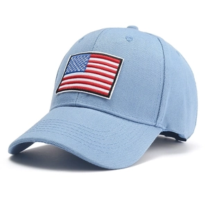 Detail of light blue twill cotton baseball cap with American flag embroidery patch