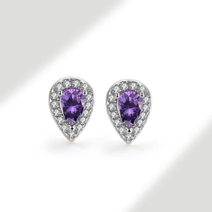 Detailed close-up of pear-shaped purple zircon earrings with white pave setting