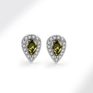 Close-up of pear-shaped olive green zircon earrings with silver halos on white background
