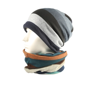 Close-up of winter fleece-lined knit hat and neck gaiter set with striped pattern