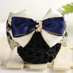 Close-up of a navy bow hair net clip with gold trim and crystal floral ornament