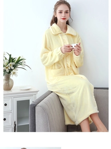 Detailed view of yellow fleece bathrobe with large pockets and elastic cuffs