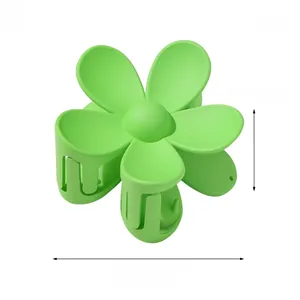 Detail view of fruit green flower hair claw clip with 7cm matte finish and size labels