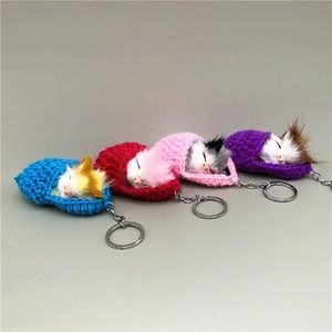 Set of 4 cute sleeping cat keychain charms in colorful knitted pouches for bags