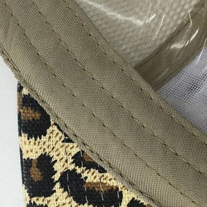 Detail of leopard print canvas and reinforced khaki webbing on breathable mesh cap