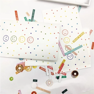 DIY colorful polka dot gift bags with vibrant emoji patterns and English quote stickers