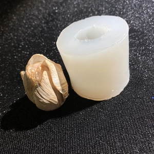Macro shot of white translucent silicone rose bud mold for DIY resin and candle making