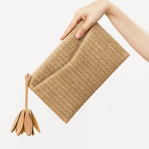Chic straw woven clutch bag for women with brown leather tassel and zipper closure
