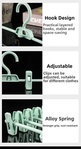 Detail of mint green trouser rack with adjustable clips and space-saving stacking hooks