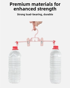 Strong load-bearing pink plastic pants hanger with adjustable clips holding heavy water bottles