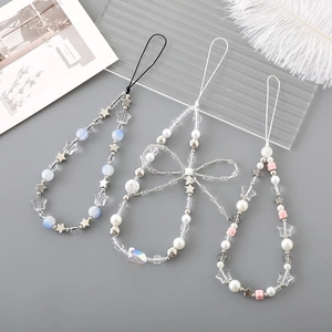 Detailed set of handmade pearl and star beaded phone straps with bow and acrylic charms