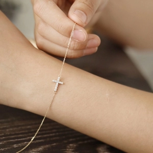 Minimalist sterling silver cross bracelet for women with pavé cubic zirconia inlay