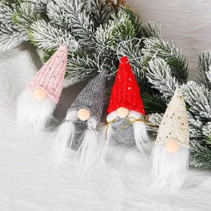 Set of four knitted sequin Christmas gnomes in pink, grey, red, and beige hanging ornaments