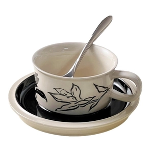 Vintage hand-painted floral ceramic coffee cup and saucer set with a metal spoon