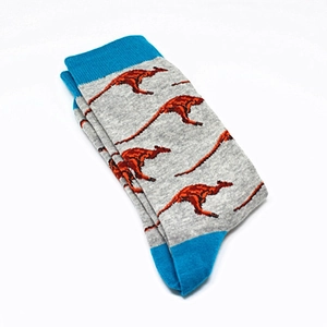 Detail of grey cotton mid-calf socks featuring orange kangaroo patterns and blue accents