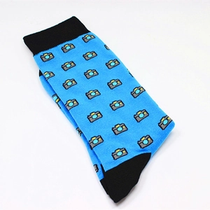 Detail of sky blue cotton crew socks featuring black accents and cartoon camera patterns