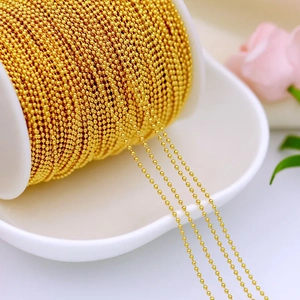 Close-up of bulk 18K gold plated bead chain roll for DIY jewelry making and necklaces