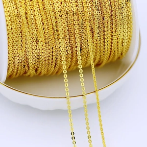 Close-up of 18K gold plated flat oval link chain spool for DIY jewelry making