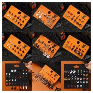 Detail view of 18-pair Halloween earring set featuring pumpkin, ghost, and bat motifs