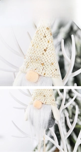 Detail of Christmas gnome ornament with sequins, knit hat and long white faux fur beard