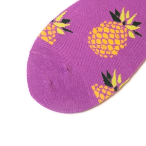Purple cotton crew socks featuring yellow pineapple patterns on a clean white background