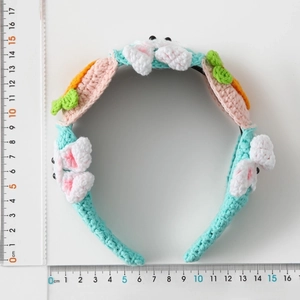 Handmade crochet bunny headband with carrot decor in mint green, 13cm width view