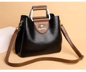 Detailed view of the textured PU leather tote bag with metal buckle and brand logo