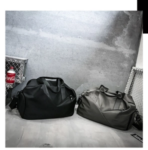 Black and grey large travel duffel bags with detachable shoulder straps for fitness and sport