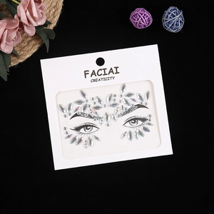 Macro detail of iridescent AB rhinestones for face makeup on a white display card