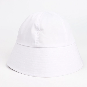 Close-up of a white bucket hat showing detailed multi-row stitching on the wide brim