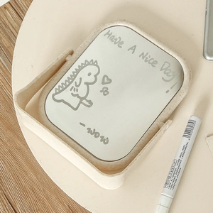 Foldable desktop makeup mirror with beige frame and cute dinosaur pattern illustration