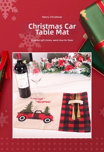 Close-up of burlap Christmas placemat with red plaid truck embroidery and cutlery pocket