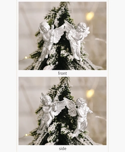 Silver glitter angel ornaments playing instruments on a Christmas tree branch
