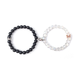 Macro detail of magnetic couples bracelets with matte black and translucent stone beads