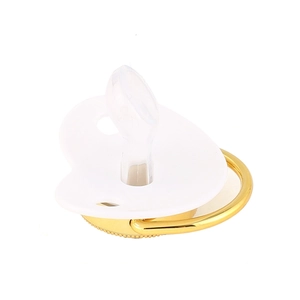 White baby pacifier with gold letter detailing and transparent silicone nipple