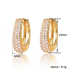 Gold pave-set hoop earrings with 22mm diameter and heart hollow-out design patterns