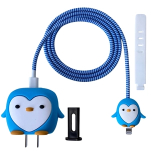 Close-up of cute penguin silicone charger cover kit with cable protectors and spiral wrap