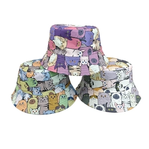 Fashionable bucket hats with colorful cartoon cat digital prints on a white background