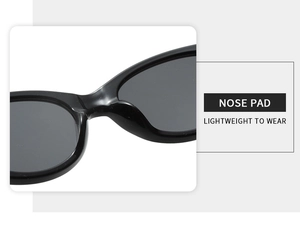 Detail view of the integrated nose pad on black oval cat-eye sunglasses for comfort