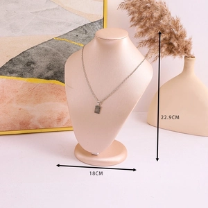 Detail view of pink velvet necklace display bust with dimensions 22.9cm by 18cm