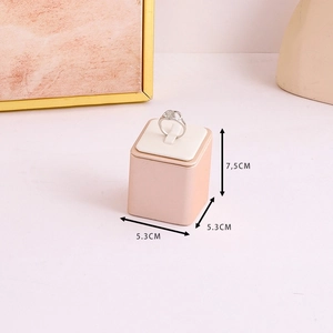 Pink PU leather jewelry ring display stand base with dimensions 5.3x5.3x7.5cm