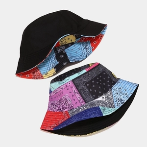 Double-sided paisley bucket hat with solid black interior for sun protection
