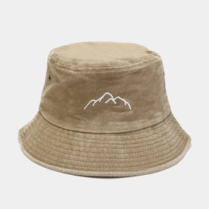 Detail shot of the mountain peak embroidery on washed khaki cotton bucket hat