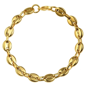 Macro view of gold coffee bean link chain bracelet with polished stainless steel finish