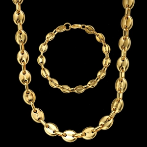 Detailed close-up of golden coffee bean link chain set with necklace and bracelet