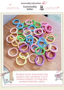 Macro detail of 3.5cm colorful nylon towel scrunchies set on a wooden surface