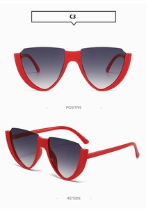 Close-up of red cat-eye sunglasses with unique V-shape semi-rimless frames and dark grey lenses